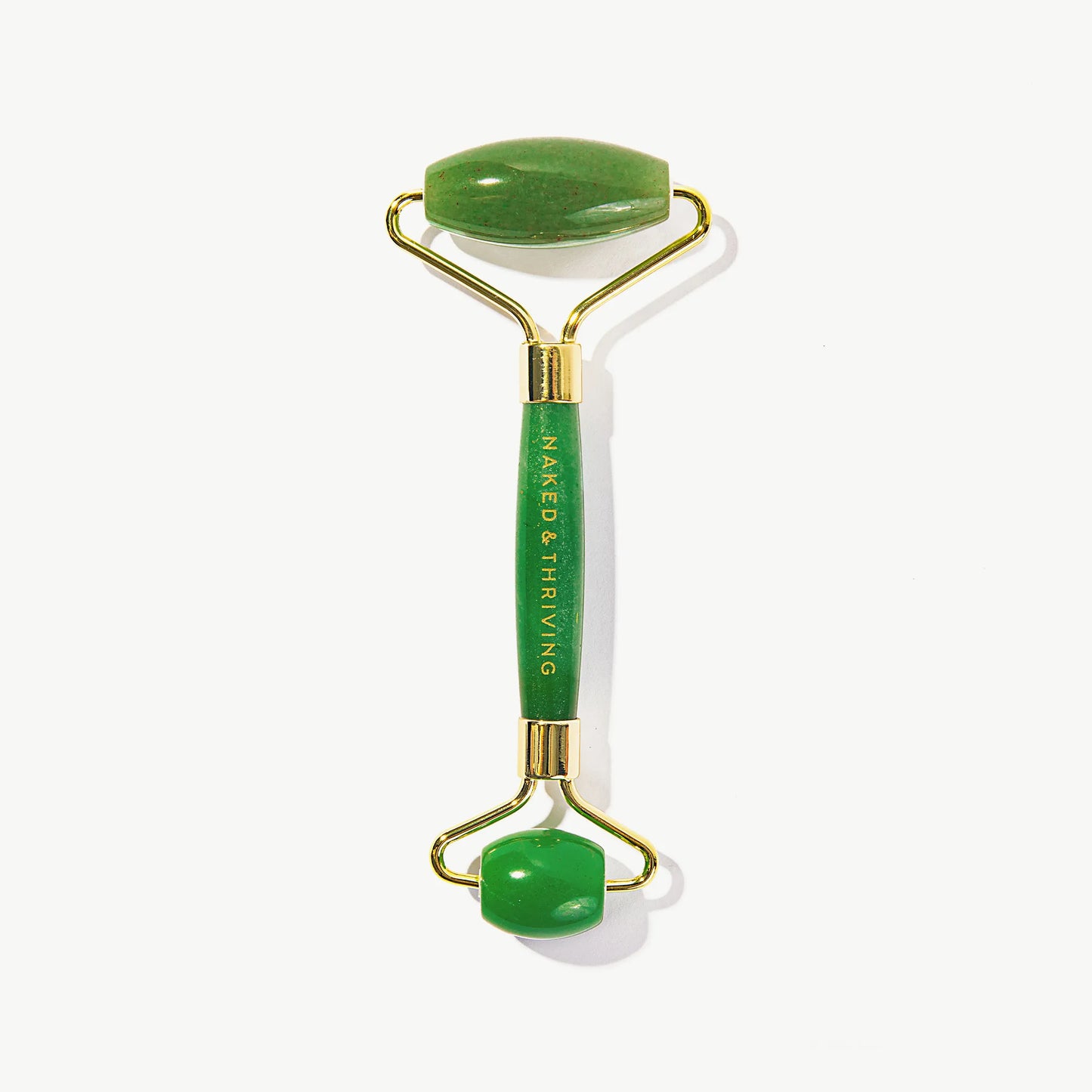 Naked & Thriving green jade facial roller massage tool on white background