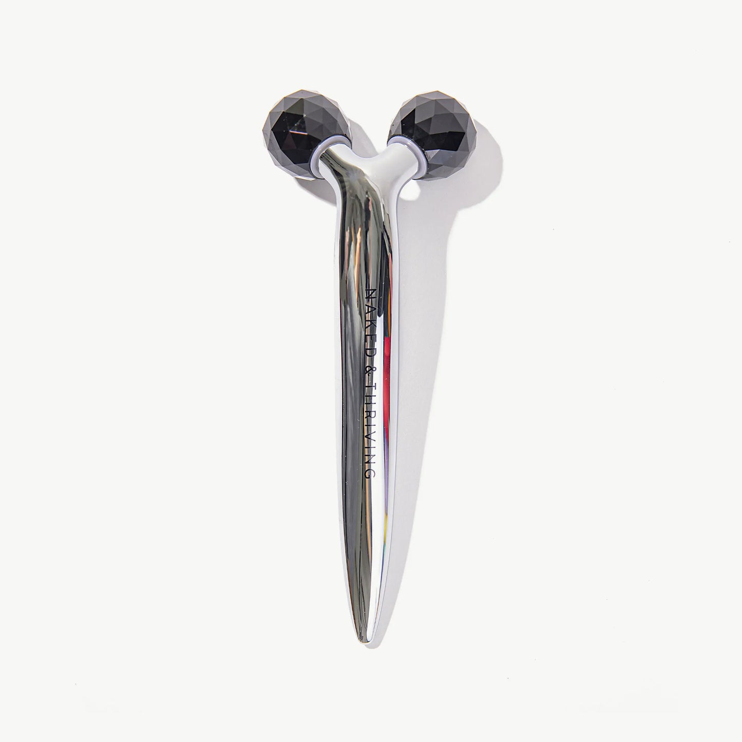 Obsidian sculpting facial roller with dual heads on a white background