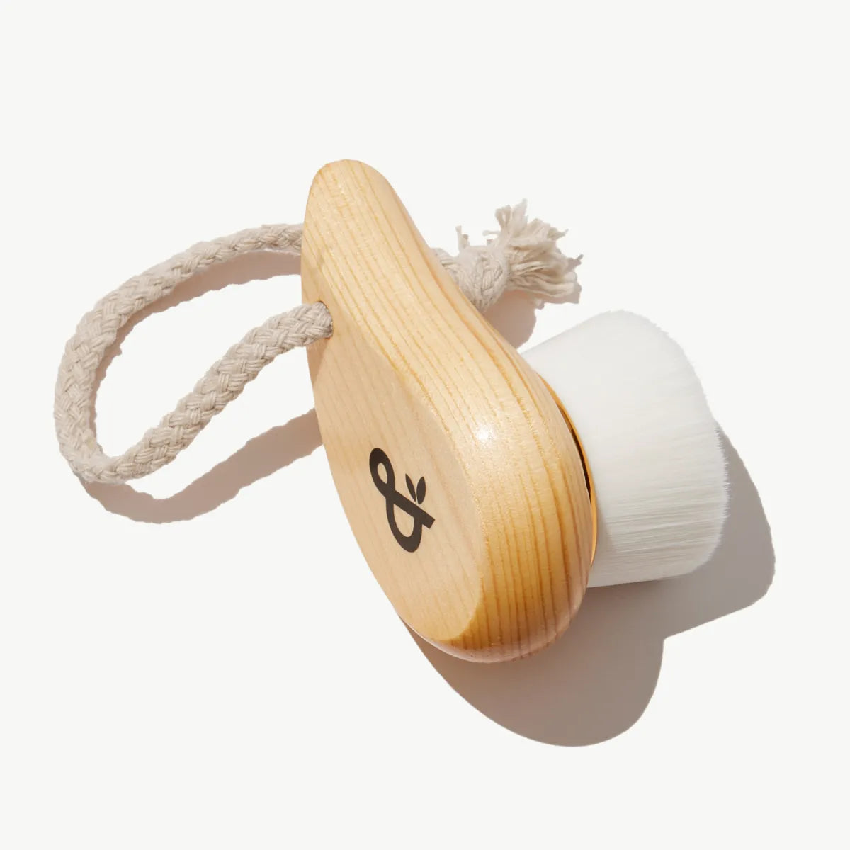 Ultra-Plush Cleansing Brush with wooden handle, shown from the side