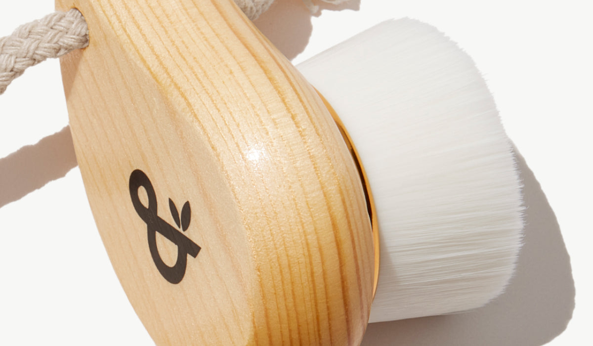 Ultra-Plush Cleansing Brush with wooden handle, shown from the side