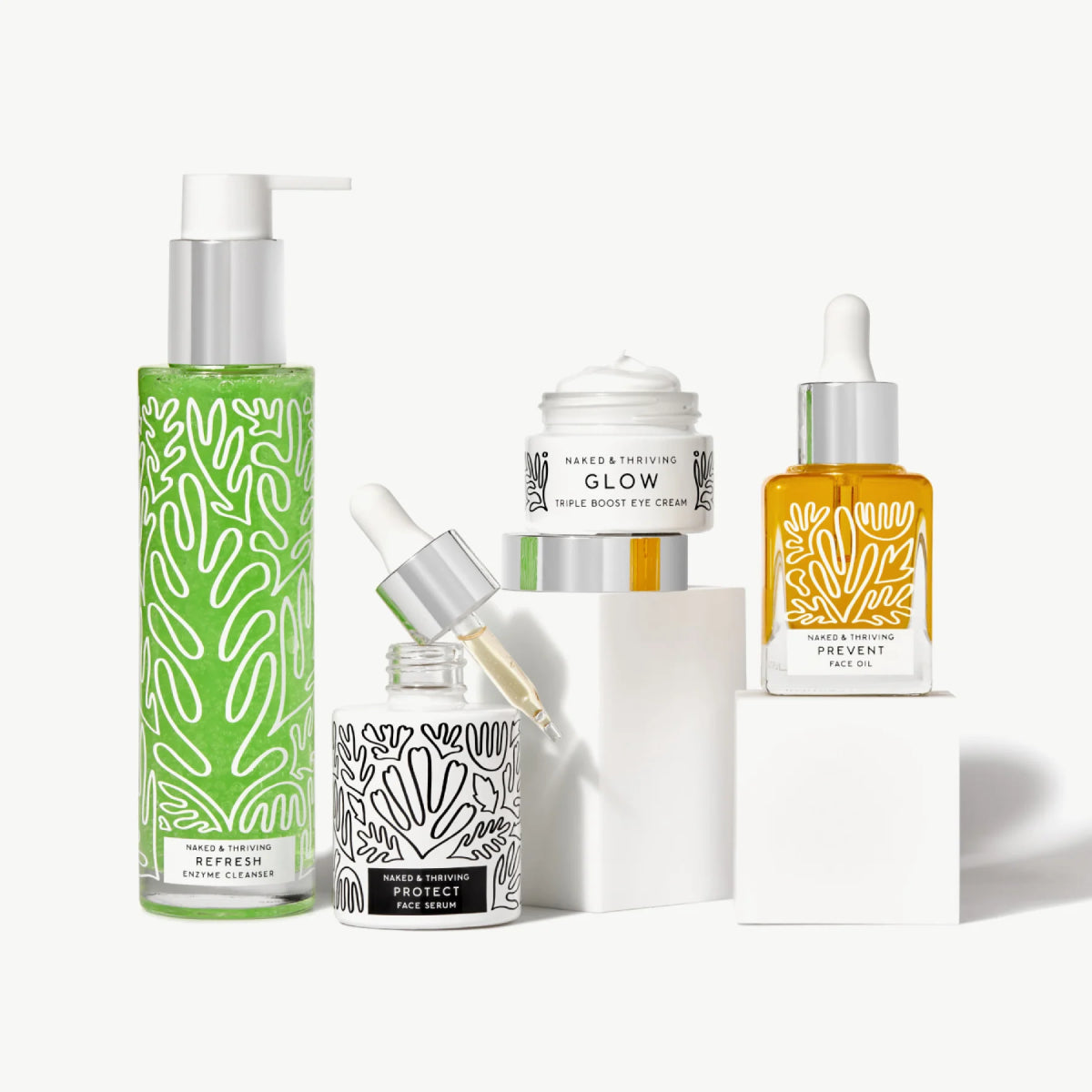 Naked & Thriving Age-Defying Routine of botanical-patterned bottles and one jar