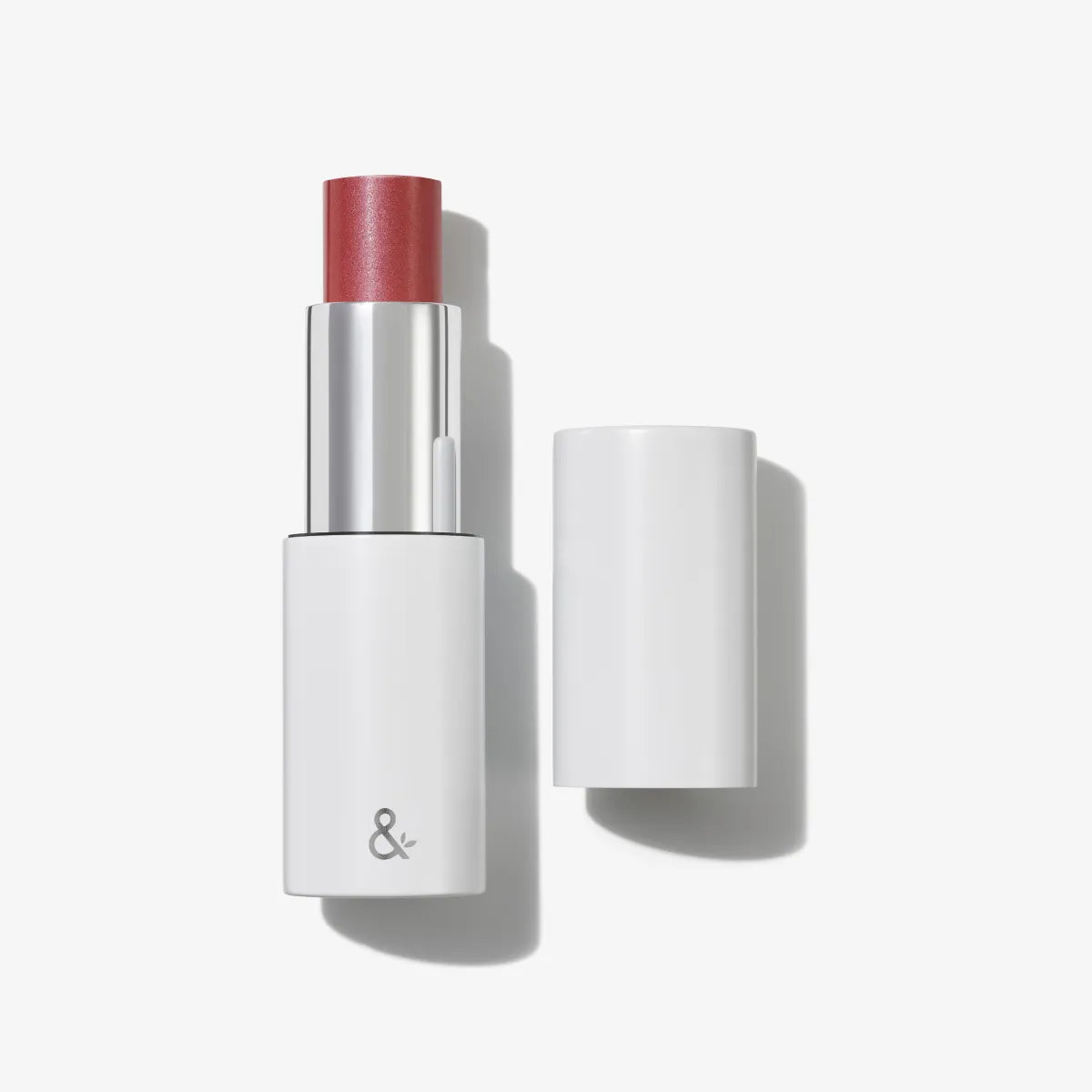 HydraTint multi-stick with cap removed showing coral-colored balm