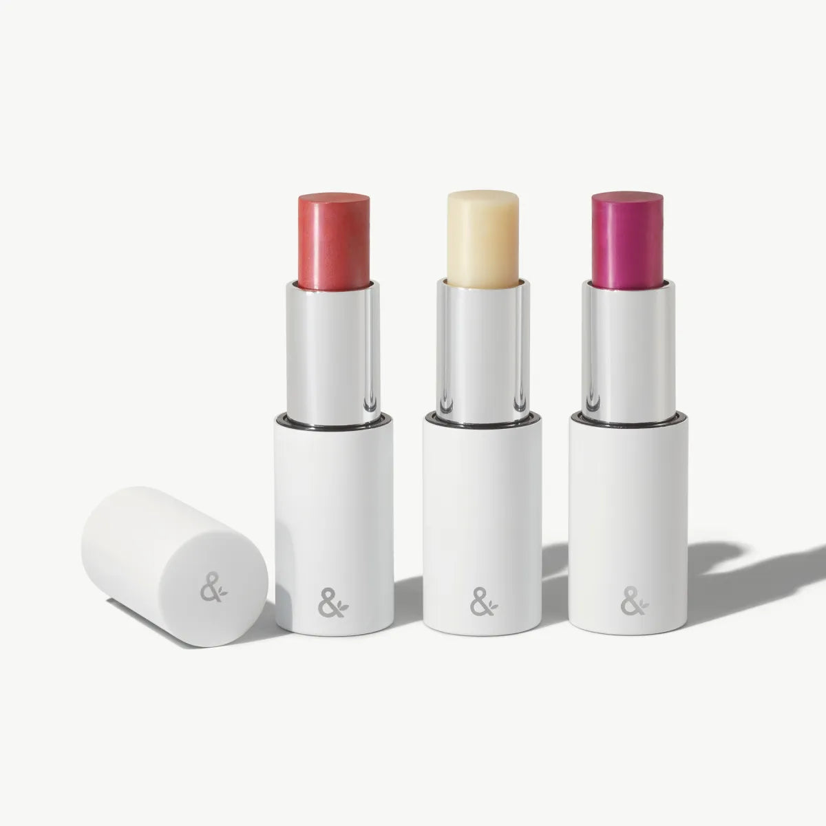 HydraTint Collection refill with Wild, Plum, and Naked sticks in white tubes on a light background