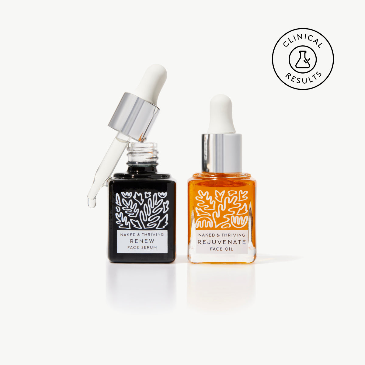 Naked & Thriving Mini Night Set with travel-size patterned Renew Resurfacing Night Serum and Rejuvenate Restorative Face Oil bottles