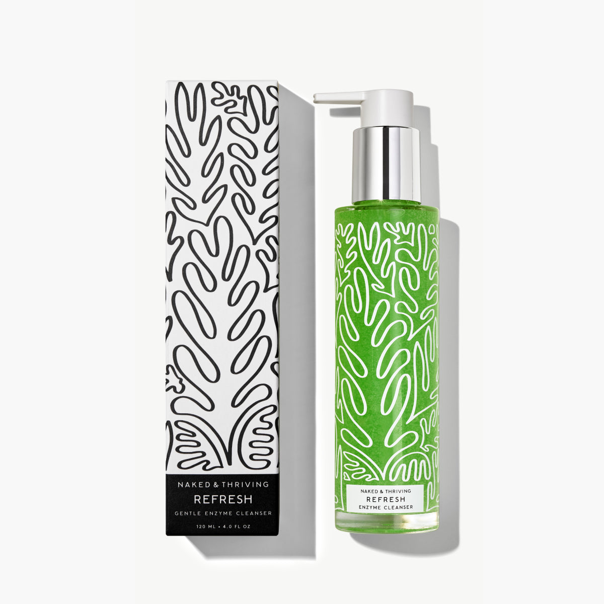 Naked & Thriving Refresh Gentle Enzyme Cleanser showing green formula in a clear pump bottle beside black and white, botanical-patterned box