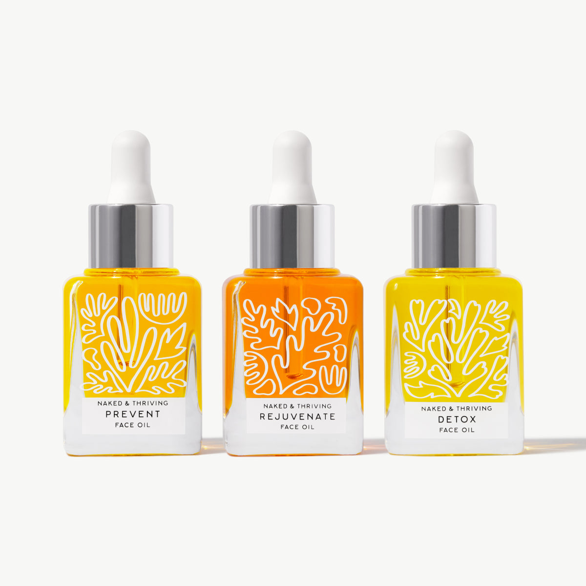 Naked & Thriving The Thriving Set with yellow and orange face oils in dropper bottles